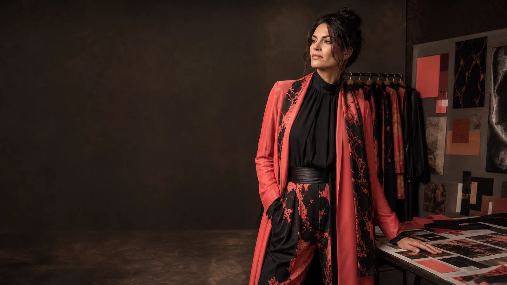 An adult model stands in a dark bronze character-styling studio.